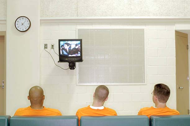inmates watching tv in the jail